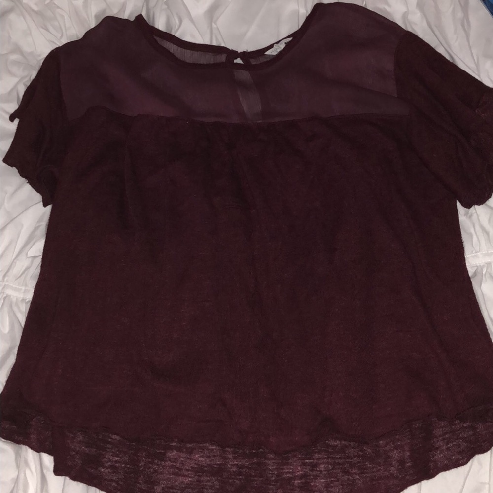 red shirt that’s sheer at the top
